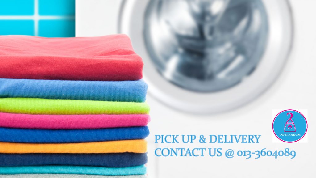Warna-warni tumpukan pakaian dilipat - perkhidmatan dobi di Malaysia
